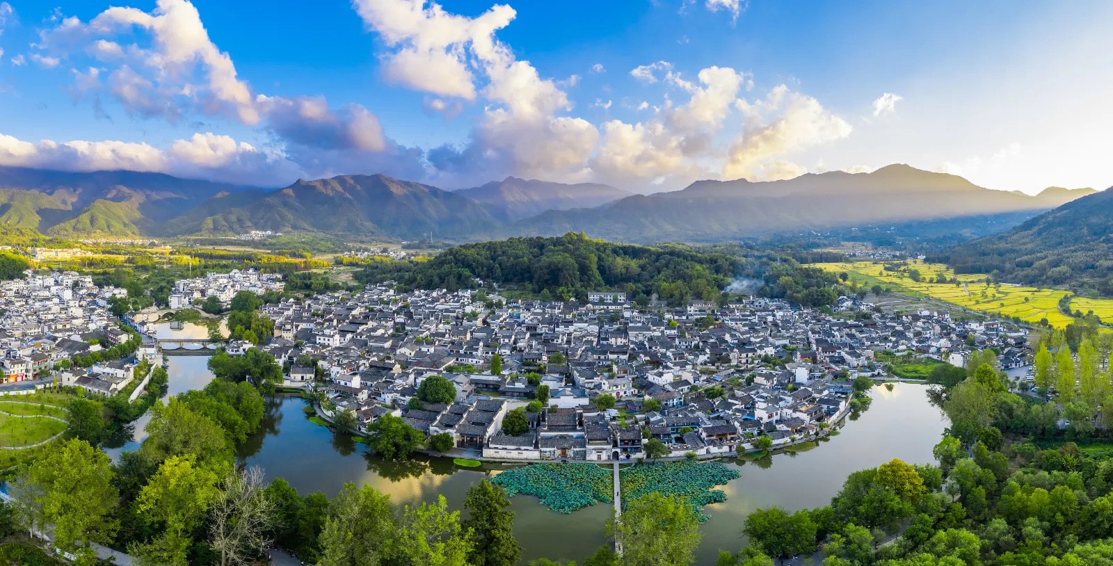 Traditional village buildings surrounded by hills in Hongcun